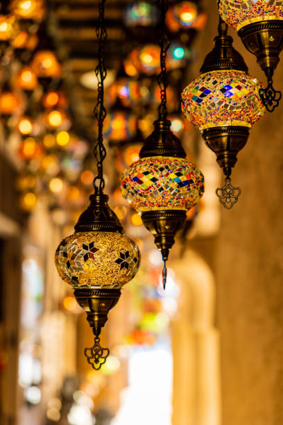 istock Traditional handmade multicolor Turkish, Moroccan, Arabian lamps hanging with nice blurred background. Mosaic style and colored glass lantern. Suitable for Ramadan Kareem greeting. 1365126091