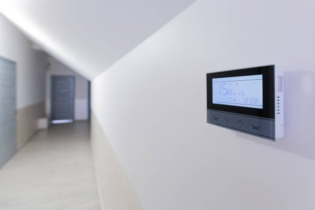 istock Control panel, air conditioning and heating system of the house, on a white wall, smart home 1365127279