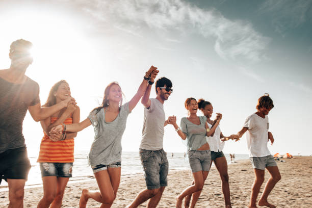 istock happiness friends all together at the beach 1365127287