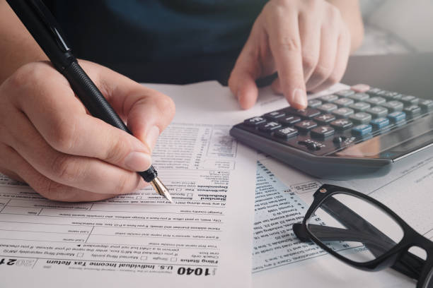 istock Tax return concept wits US 1040 tax form 1365127324