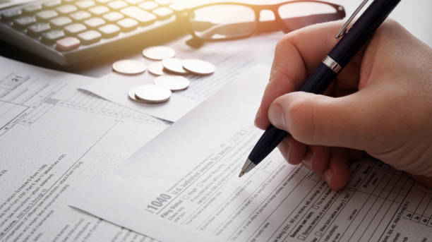 istock Tax return concept wits US 1040 tax form 1365127371