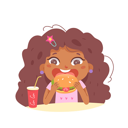 Hungry kid eating fastfood hamburger, enjoying unhealthy food, girl sitting at table
