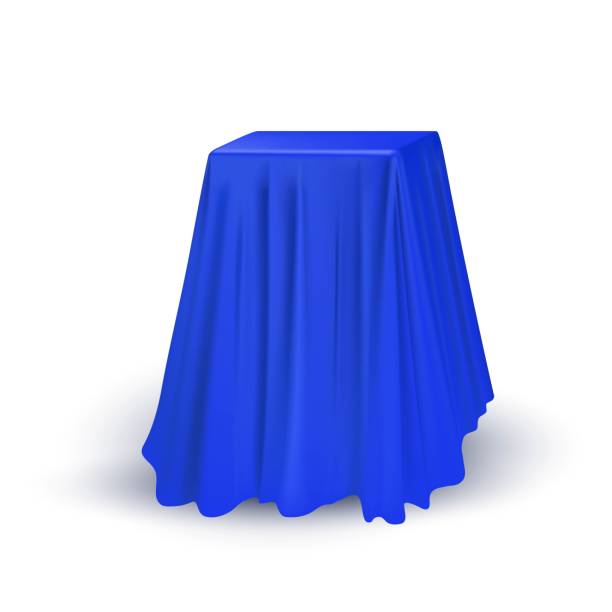 istock Blue cloth drapery covering square table. Silk fabric hanging on gift for surprise reveal vector illustration. Hidden secret under veil decoration. Mysterious presentation event 1365127990
