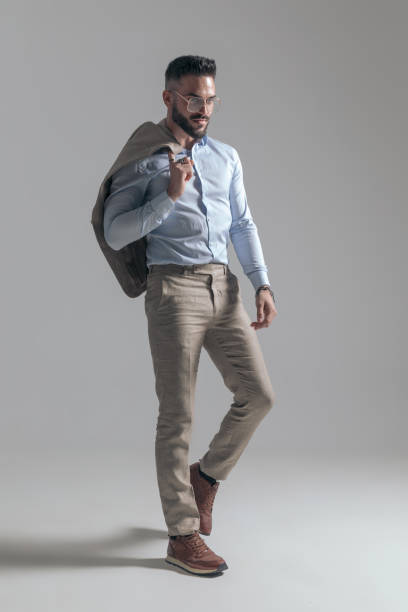 istock attractive young man with jacket over shoulder looking to side 1365128673
