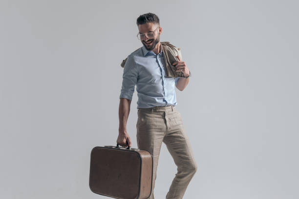 istock enthusiastic businessman looking down and smiling 1365128848