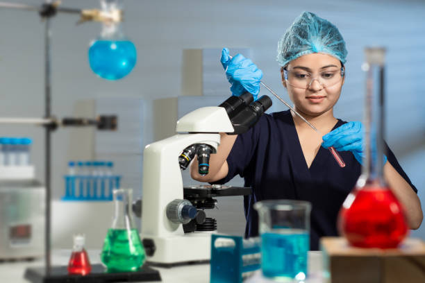 istock Young Asian Indian good looking female Lab Technician. 1365130885