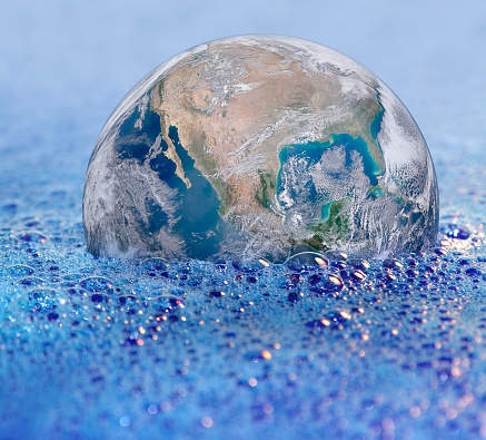 Pollution and cleaning theme showing a terrestrial globe partly submerged by lots of soapspuds