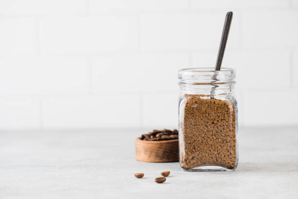 istock A glass jar with instant coffee and a teaspoon. Copy space. 1365132042