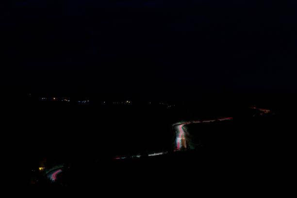istock trace of car lights 1365133725