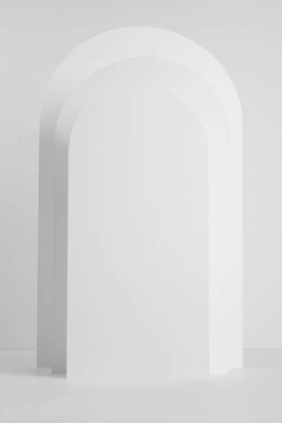 istock Fashion rectangle white rounded arches as scene mockup in sunlight with shadows as podium for presentation, showing, display of cosmetic product, design, advertising in minimal style, vertical. 1365134392
