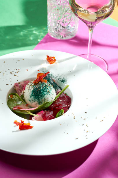 istock Poached egg with pear confit in a white plate. Colored backgrounds. Hard light. selective focus 1365134570