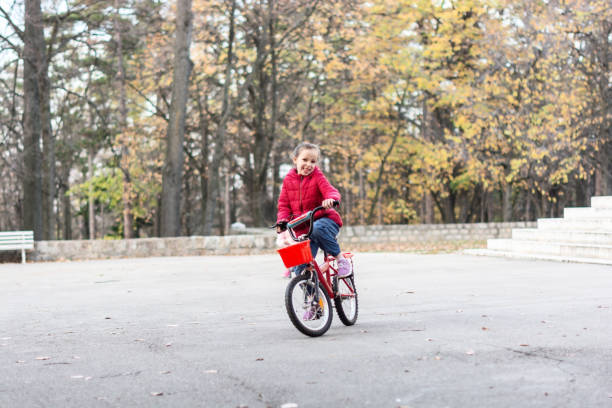 istock Child riding a bike 1365135240