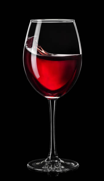 istock moving red wine in glass isolated on black 1365137362