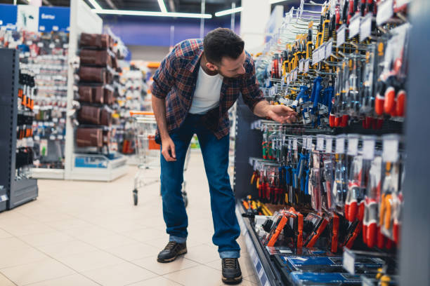 istock buyer man in a hardware store chooses pliers and wire cutters. 1365137455