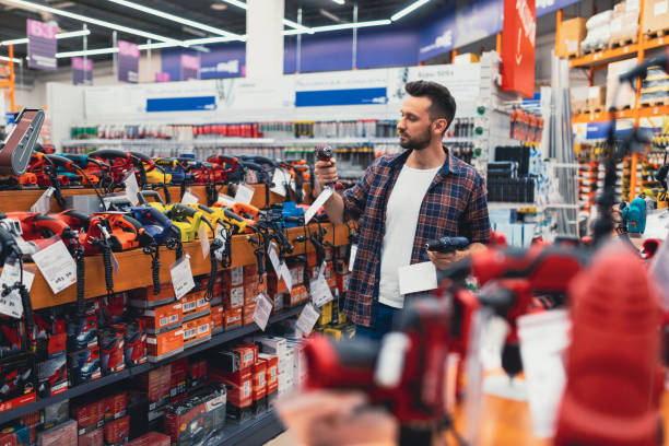 istock a customer in a hardware store compares two screwdrivers 1365137490