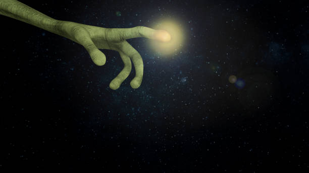 istock Alien pointing a finger with light at the finger tip 1365137515