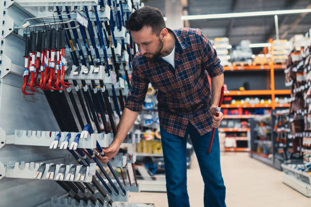istock a buyer in a construction hypermarket chooses a nail puller 1365138350
