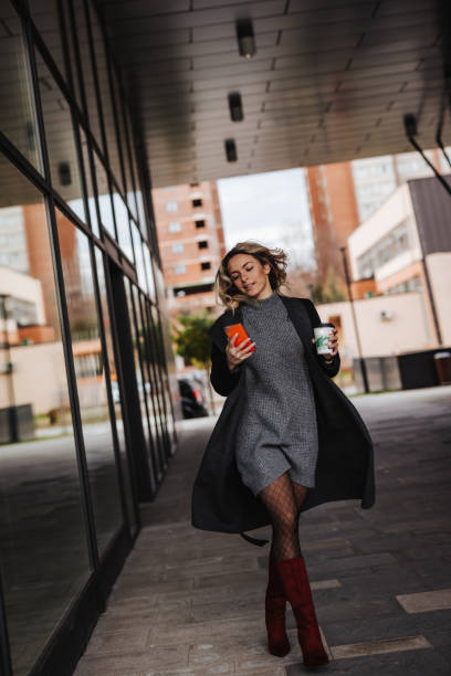 istock Business woman talking on phone while commuting to work 1365138687