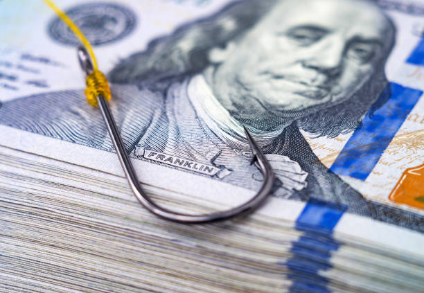 fish hook on a stack of us 100 dollar bills. - mammillaria cactus imagens e fotografias de stock