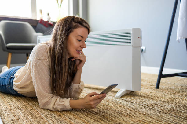 istock Beautiful lady spending leisure time using smartphone at home. 1365146742