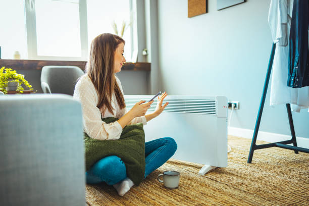 istock Beautiful lady spending leisure time using smartphone at home. 1365146828