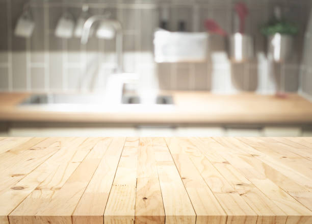 istock Selective focus.Wood table top on blur kitchen counter background. 1365147833