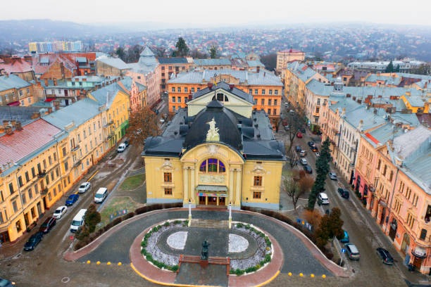 Ukraine, Chernivtsi, January 9, 2022: The famous Chernivtsi Drama Theater is an architectural monument of Bukovina, Ukraine and Europe. Winter dem drone flies over his square old housesUkraine,