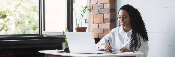 Woman designer working from home, having meeting online. Student girl studying in her room Businesswoman working on laptop computer in office. Panoramic banner. Creative occupation, work from home, freelance, online learning, lockdown, studying concept. Distance education e learning stock pictures, royalty-free photos & images