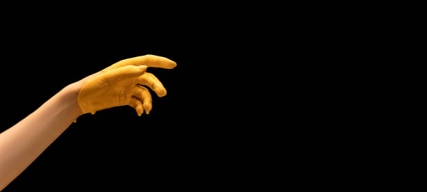 istock Flyer with painted human hand gesturing isolated on black studio background. Concept of human relation, symbolism, culture and history 1365149318