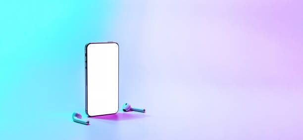 istock Smartphone screen. Mobile smart phone technology blank screen. Mock up smart phone device, audio headphones equipment on neon gradient background. For text message, information content, clipping path. 1365150070