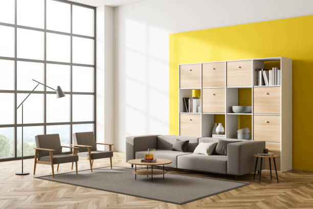istock Light relaxing room interior with armchairs, sofa and bookshelf with window 1365154453