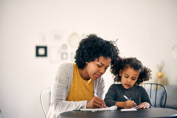 istock Little african-american girl, doing her assignment. 1365156016