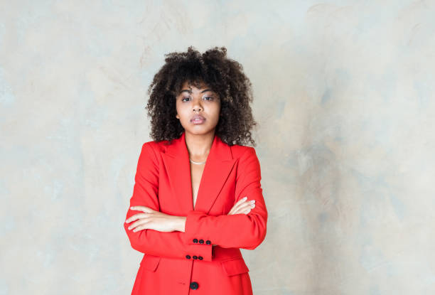istock Confident young woman wearing red blazer 1365156998