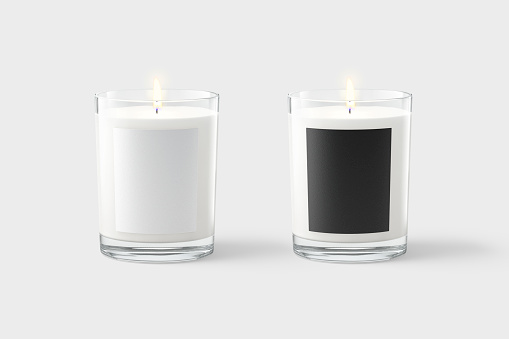 Blank candle in glass jar with black and white label mockup, gray background, 3d rendering. Empty transparent tumbler with pillar or votive candles mock up, front view. Decor candlewick tempalate.