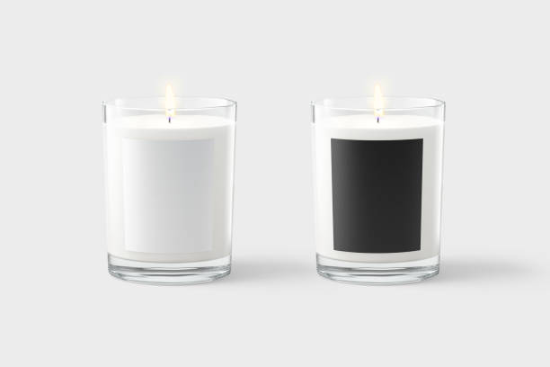 Blank candle in glass jar with black, white label mockup Blank candle in glass jar with black and white label mockup, gray background, 3d rendering. Empty transparent tumbler with pillar or votive candles mock up, front view. Decor candlewick tempalate. candlelight stock pictures, royalty-free photos & images