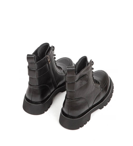 istock Woman's leather warm winter boots over white background 1365159363