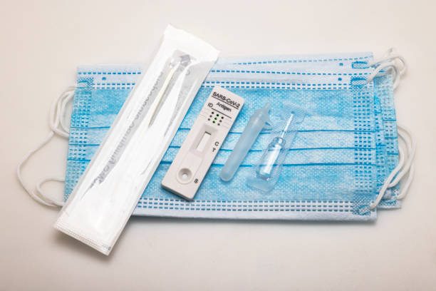 istock SARS CoV-2 Rapid antigen test kit (ATK)on face mask , Coronavirus infectious protective concept 1365161003