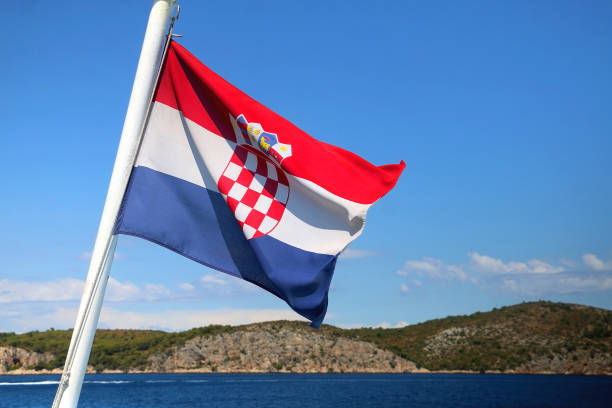 istock Croatian Flag and Adriatic Sea 1365167436
