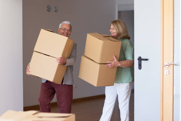 istock Smiling elderly couple moving into new house 1365167533