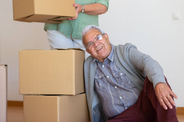 istock Joyful elderly couple moving into new apartment 1365169218