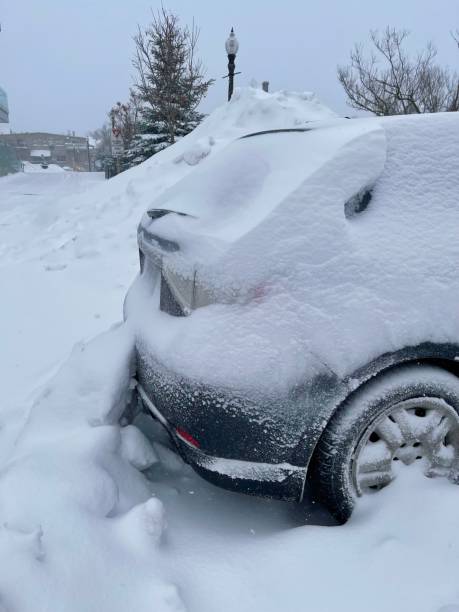 istock Snow storm vehicle in stuck in snow 1365170565