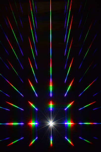 Illustration of a rainbow-colored laser beam that illuminates the darkness