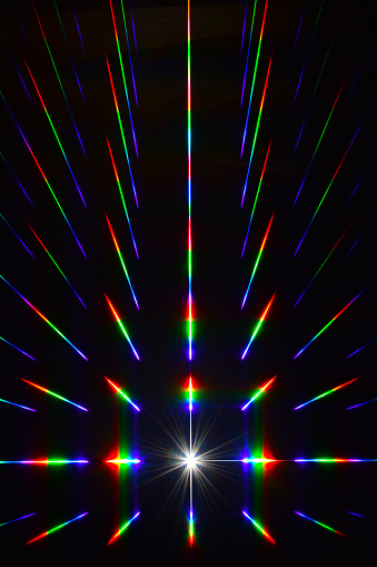 White light passes through the diffraction grating of the RGB filter and creates correct geometric rays in red, green and blue with rainbow transitions.