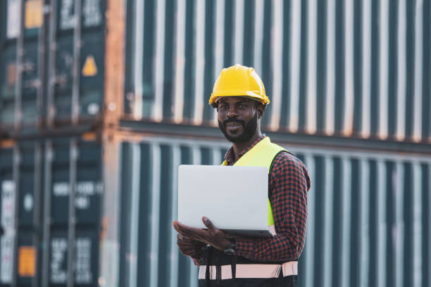 istock African american worker using laptop computer inspecting the containers. to manage the export of goods to foreign countries 1365173604