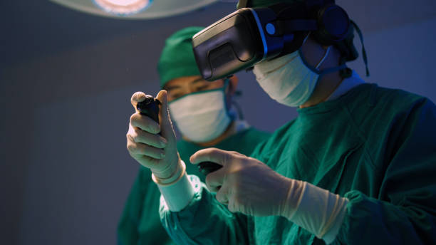 Future medical innovations. Professional surgeons in  uniform and VR headset performing operation on patient in modern clinic. health technology photos stock pictures, royalty-free photos & images