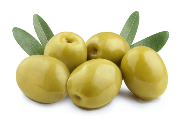 istock Delicious green olives with leaves on white 1365177971