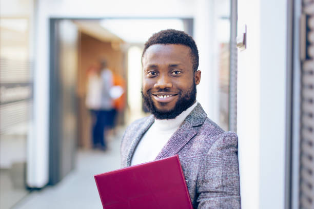 istock Young businessman happy to be back to work 1365178140
