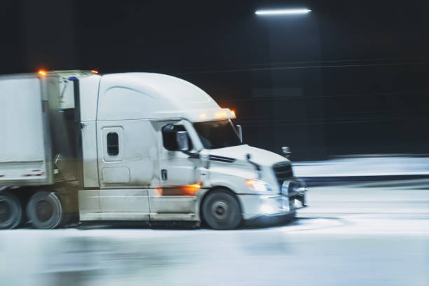istock Semi Truck on Highway in Winter 1365180009