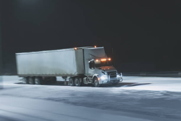 istock Semi Truck on Highway in Winter 1365180022