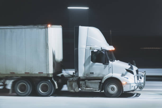 istock Semi Truck on Highway in Winter 1365180024